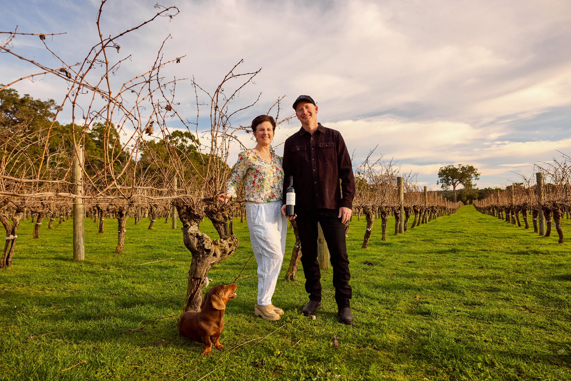Scott and Annette Baxter in the vineyard at Gralyn Estate, Wilyabrup, Margaret River — second-generation custodians of the family winery founded in 1975.